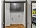 Laundry room with black cabinets, hardwood floors, and neutral paint at 4576 Dorset Circle, Decatur, GA 30035