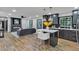 Open concept living room and kitchen with fireplace, hardwood floors, and modern decor at 4576 Dorset Circle, Decatur, GA 30035