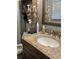 Cozy bathroom featuring a decorative vanity with granite countertop at 497 Natasha Dr, Auburn, GA 30011
