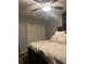 Bedroom features a decorative ceiling fan and comfortable bed at 497 Natasha Dr, Auburn, GA 30011