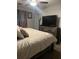 Bedroom featuring a TV, dresser, carpet, and bed at 497 Natasha Dr, Auburn, GA 30011