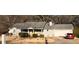 Charming single-story home featuring a well-maintained lawn and attached two car garage at 497 Natasha Dr, Auburn, GA 30011