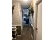 Neutral hallway showcasing a view into a living area at 497 Natasha Dr, Auburn, GA 30011