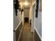 Hallway view features neutral walls, white trim, and framed art at 497 Natasha Dr, Auburn, GA 30011