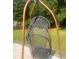 Relaxing hanging chair on the patio, perfect for enjoying the outdoors at 497 Natasha Dr, Auburn, GA 30011