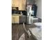 Traditional kitchen featuring stainless steel appliances, custom cabinets, dark countertops, and wood flooring at 497 Natasha Dr, Auburn, GA 30011