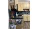 Kitchen featuring stainless steel appliances, custom cabinets, and dark countertops provide ample space for cooking at 497 Natasha Dr, Auburn, GA 30011