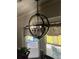 Modern light fixture illuminates the cozy dining area with large window bringing in natural light at 497 Natasha Dr, Auburn, GA 30011