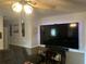 A cozy living room features a ceiling fan and a large flatscreen television at 497 Natasha Dr, Auburn, GA 30011