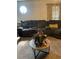 Well-appointed living room with plush sectional sofa and round coffee table at 497 Natasha Dr, Auburn, GA 30011