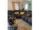 Inviting living room showcases a cozy sectional sofa, decorative pillows, and a stylish coffee table at 497 Natasha Dr, Auburn, GA 30011