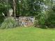 Well-maintained backyard featuring a decorative fence and lush greenery for privacy at 3 Perthshire Dr, Peachtree City, GA 30269