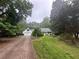 Traditional home with verdant lawn, beautiful mature trees, and large driveway at 3 Perthshire Dr, Peachtree City, GA 30269