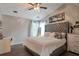 Comfortable bedroom features a tufted headboard, soft lighting, and neutral paint at 3130 Jorden Crest Ct, Lawrenceville, GA 30044