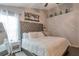Bright bedroom featuring a tufted headboard, soft lighting, and neutral paint at 3130 Jorden Crest Ct, Lawrenceville, GA 30044