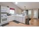 Kitchen featuring white cabinetry, stainless steel appliances, and lots of natural light at 3130 Jorden Crest Ct, Lawrenceville, GA 30044