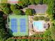 Aerial view of the community pool and tennis courts nestled in a natural area, a great amenity at 5105 Tynewick Ne Trce, Roswell, GA 30075