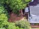 Aerial view of a home surrounded by a lush yard and mature trees offering a private backyard retreat at 5105 Tynewick Ne Trce, Roswell, GA 30075