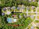 Aerial view of home near community pool and tennis courts, surrounded by lush trees, a great location! at 5105 Tynewick Ne Trce, Roswell, GA 30075