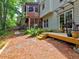 Beautiful backyard with a deck, screened porch, stone pathway, and lush landscaping at 5105 Tynewick Ne Trce, Roswell, GA 30075