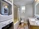 This is a full bathroom with a shower over tub with a laundry center for the ultimate in convenience at 5105 Tynewick Ne Trce, Roswell, GA 30075