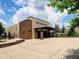 Exterior view of Pope High School with brick and concrete facade, landscaping, and entrance at 5105 Tynewick Ne Trce, Roswell, GA 30075