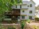 Exterior back view with patio, screened in porch, and wooden deck at 5105 Tynewick Ne Trce, Roswell, GA 30075