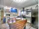 This is a kitchen featuring a stainless steel oven and blue cabinets, and custom boat shaped kitchen island at 5105 Tynewick Ne Trce, Roswell, GA 30075