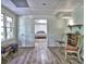 Cozy room with hardwood floors, a bedroom view, and natural light, providing a tranquil ambiance at 5105 Tynewick Ne Trce, Roswell, GA 30075