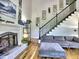 Living room with fireplace and staircase at 5105 Tynewick Ne Trce, Roswell, GA 30075