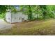 Backyard with view of a house and lush trees at 76 Burbank Dr, Atlanta, GA 30314