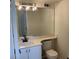 Bathroom featuring sink with bright vanity and a large well-lit mirror at 76 Burbank Dr, Atlanta, GA 30314