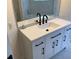 Bathroom features a stylish vanity with modern fixtures and a large mirror at 76 Burbank Dr, Atlanta, GA 30314