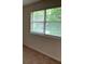 Bright bedroom featuring a window with blinds overlooking lush greenery, creating a peaceful and serene atmosphere at 76 Burbank Dr, Atlanta, GA 30314
