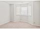 Cozy carpeted bedroom featuring a bay window with bright light at 76 Burbank Dr, Atlanta, GA 30314
