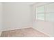 Carpeted bedroom with neutral walls and window with blinds at 76 Burbank Dr, Atlanta, GA 30314