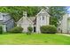 Charming two-story home with a lush green lawn and well-maintained landscaping at 76 Burbank Dr, Atlanta, GA 30314