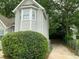 Charming home exterior showcasing light gray siding, white trim, and a well-maintained landscaped yard with mature trees at 76 Burbank Dr, Atlanta, GA 30314