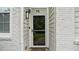 Front door of home with glass storm door, painted brick, and a 'hello' welcome mat at 76 Burbank Dr, Atlanta, GA 30314