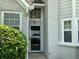 Home's front entrance featuring a storm door and an address marker at 76 Burbank Dr, Atlanta, GA 30314