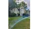 Charming two-story home featuring a lush front yard and brick chimney at 76 Burbank Dr, Atlanta, GA 30314
