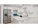 Elegant kitchen featuring white cabinets, stainless steel appliances, and a center island at 76 Burbank Dr, Atlanta, GA 30314
