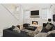Inviting living room features a fireplace with marble surround and modern decor at 76 Burbank Dr, Atlanta, GA 30314