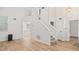 Bright living room features hardwood floors, high ceilings, and a staircase to the second floor at 76 Burbank Dr, Atlanta, GA 30314