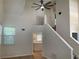 Bright living room features high ceilings, a modern ceiling fan, and easy access to the kitchen at 76 Burbank Dr, Atlanta, GA 30314