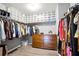 Walk-in closet with built-in shelving and clothing racks, offering ample storage and organization at 7698 Hansel Ln, Lithonia, GA 30058