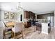 Open concept kitchen features a breakfast bar with pendant lighting and stainless steel appliances at 7698 Hansel Ln, Lithonia, GA 30058