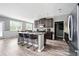 Well-appointed kitchen with an island, granite countertops, and stainless steel appliances at 7698 Hansel Ln, Lithonia, GA 30058