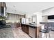 Spacious kitchen featuring granite countertops, an island, and stainless steel appliances at 7698 Hansel Ln, Lithonia, GA 30058