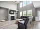 Bright living room with hardwood floors, high ceilings, fireplace and comfortable seating at 7698 Hansel Ln, Lithonia, GA 30058